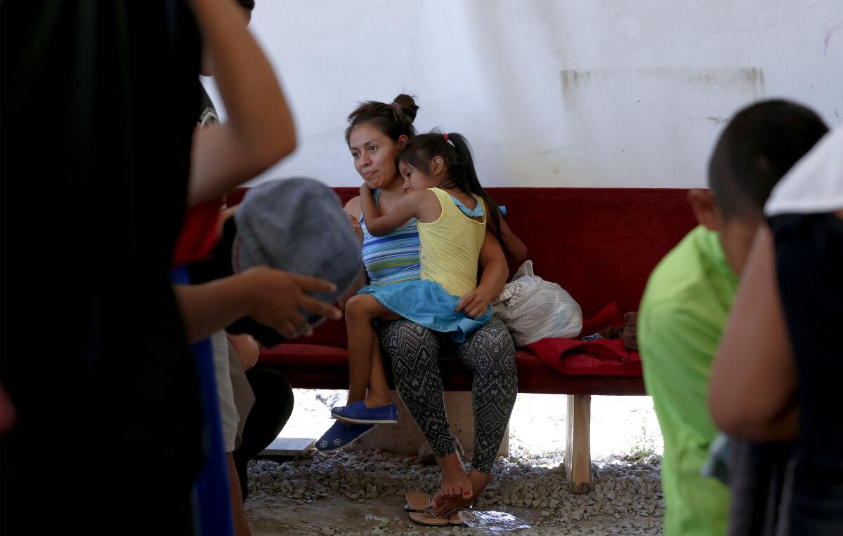 Jasmine Martinez, 34, and daughter Fernanda Martinez, 6, from Honduras enjoy their first day out of isolation on Thursday. 