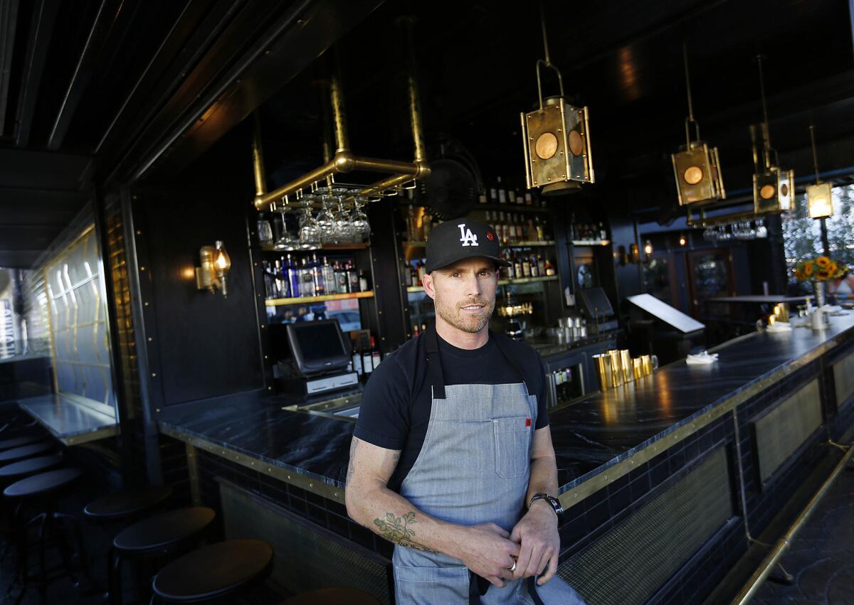 Owner and Chef, Steve Brown, poses along the bar in the outdoor patio of new restaurant Gardner Junction on 1451 N. Gardner St in LA.