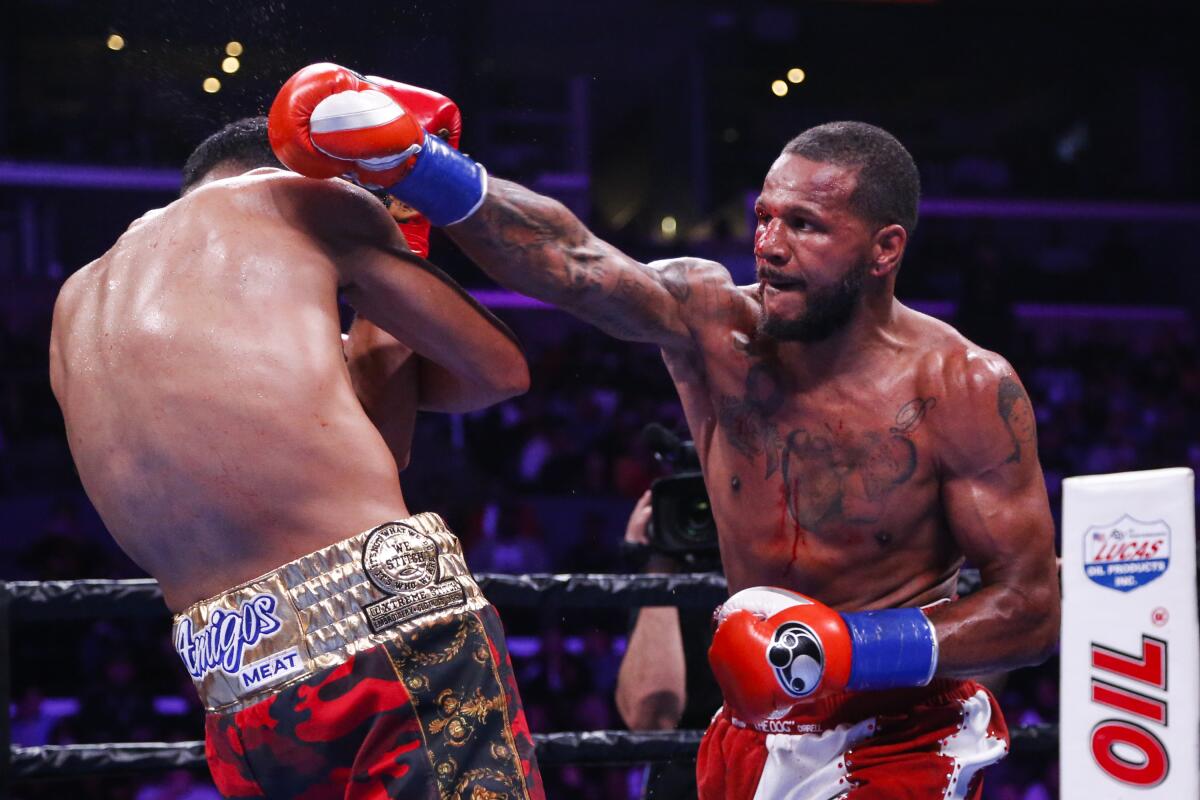 Anthony Dirrell swings at David Benavidez during a WBC World Super Middleweight Championship boxing match on Sept. 28, 2019