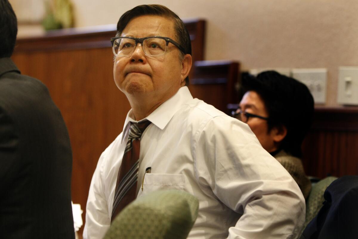 San Gabriel Councilman-elect Chin Ho Liao listens to attorney arguments during an administrative hearing to determine if he is qualified to sit on the council.