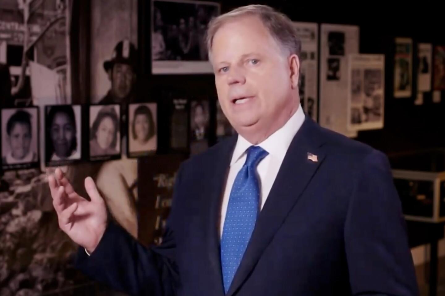 Sen. Doug Jones of Alabama addresses the convention.