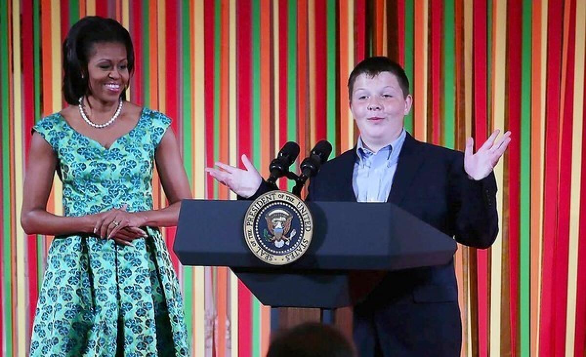 Marshall Reid, a judge of the Healthy Lunchtime Challenge, speaks as First Lady Michelle Obama hosts a Kids' "State Dinner" luncheon at the White House on Aug. 20. Lessons on portion size and healthful diets should begin early.