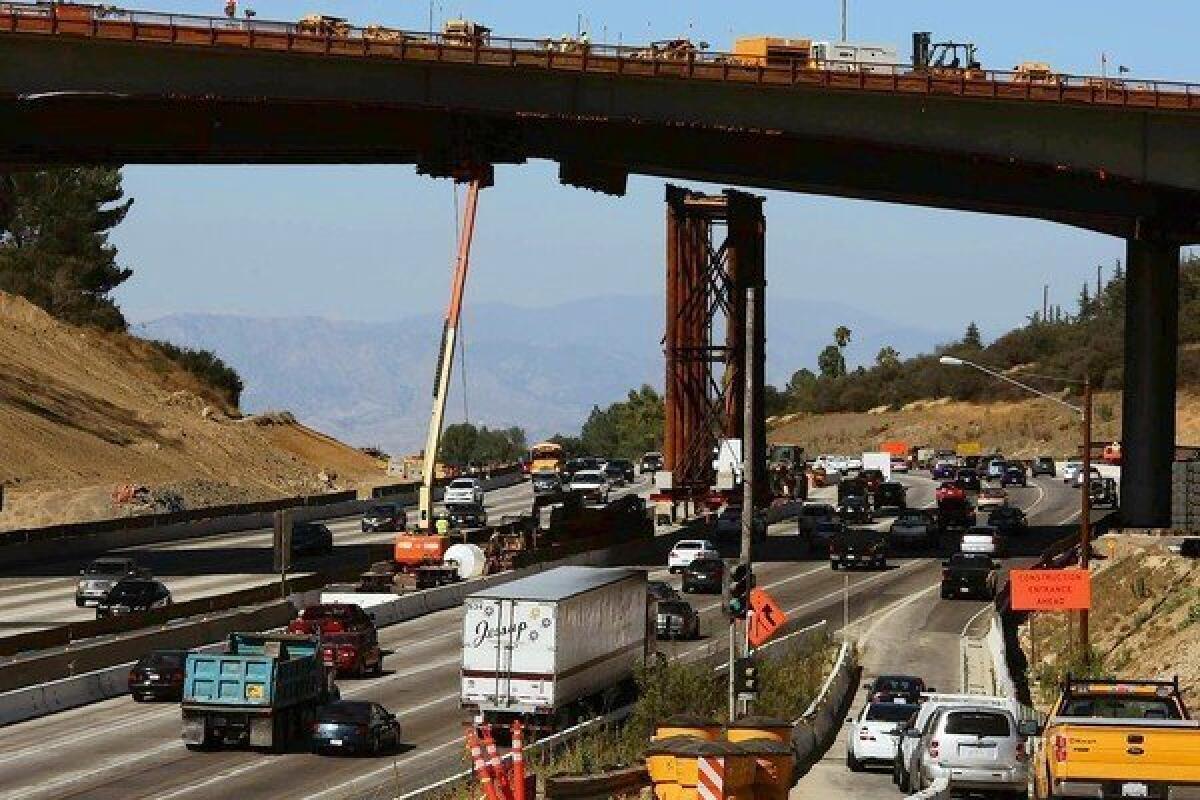 Traffic flows along the 405 Freeway last week amid work on the Mullholland Bridge in Los Angeles. Ten miles of the 405 Freeway will be closed between the 10 and 101 freeways from the evening of Sept. 28 until early morning Oct. 1.
