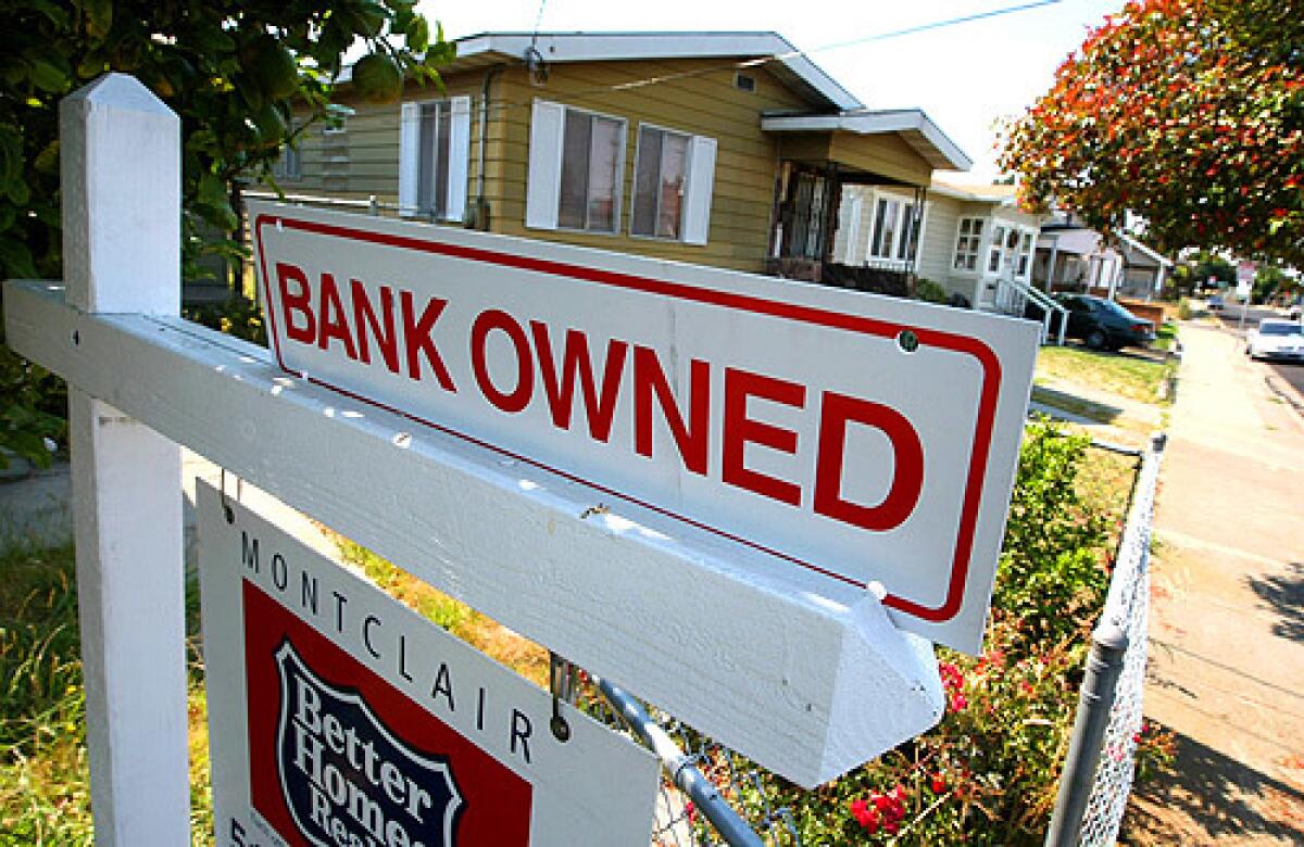 A sign is posted in front of a foreclosed home for sale on June 13, 2008, in Richmond, Calif.