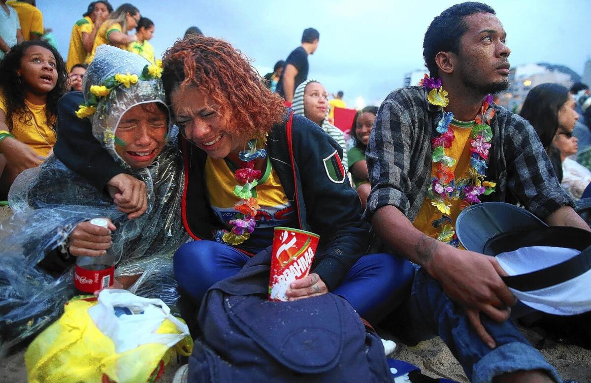 Brazil fans in Rio de Janeiro watch the semifinal match in which Germany defeated Brazil, 7-1.