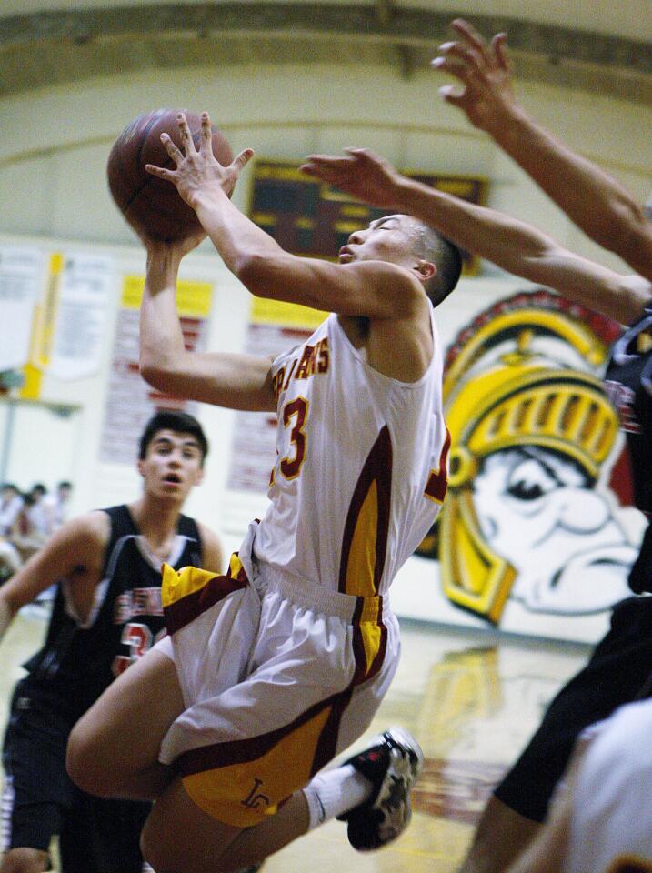 La Canada's Dan Jun drives for a layup against Glendale in the La Canada Holiday Classic boys basketball tournament at La Canada High School on Tuesday, December 17, 2013. (Tim Berger/Staff Photographer)