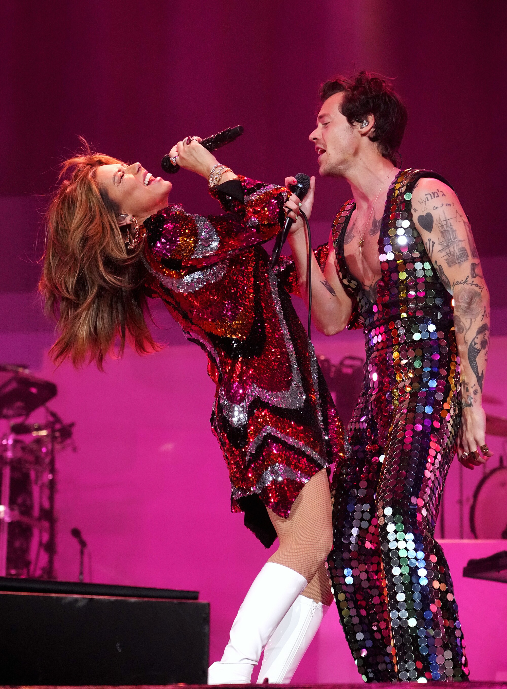 Shania Twain and Harry Styles perform in sparkly outfits.