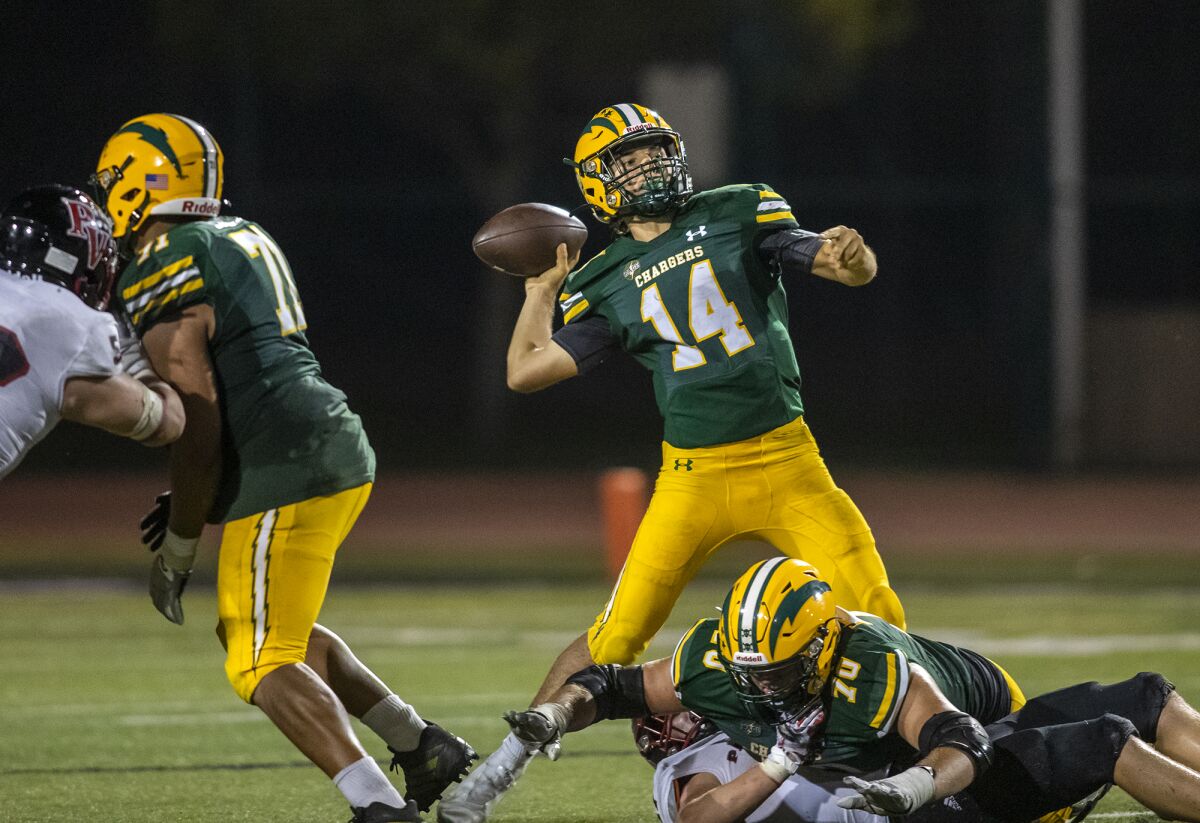 Edison's Parker Awad throws a pass under pressure during a game against Palos Verdes at Westminster High on Sept. 8, 2022.