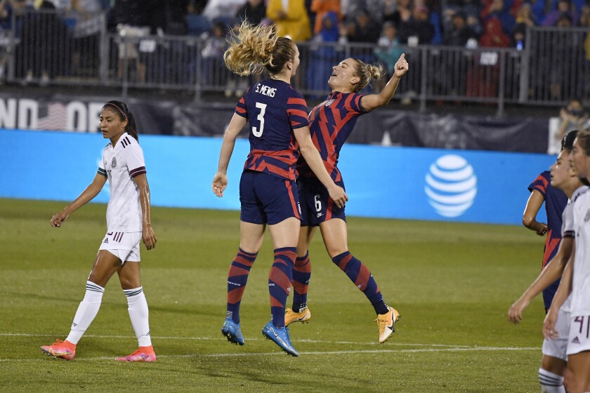 United States' Samantha Mewis, left, celebrates her goal with teammate United States' Kristie Mewis during the first half of an international friendly soccer match against Mexico, Thursday, July 1, 2021, in East Hartford, Conn. (AP Photo/Jessica Hill)
