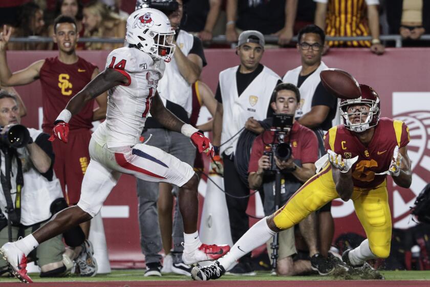 LOS ANGELES, CA, SATURDAY, AUGUST 31, 2019 - USC receiver Michael Pittman Jr. catches a pass past Fresno State cornerback Jaron Bryant in the end zone during second quarter action at the Coliseum. Pittman was ruled out of bounds so the catch was nullified. (Robert Gauthier/Los Angeles Times)