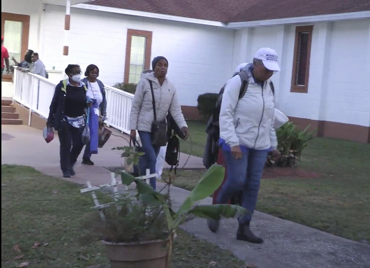 People who attended a festival on Sapelo Island leave a church.