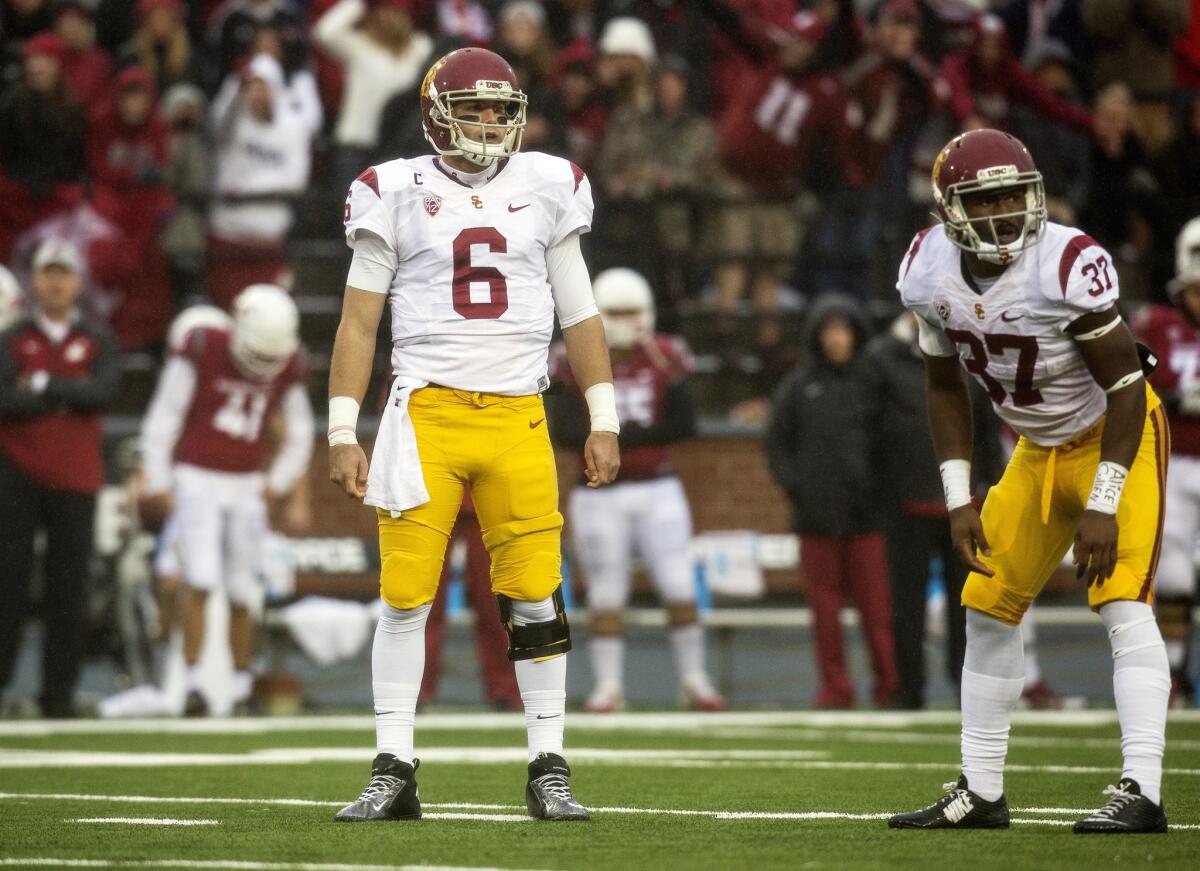 USC quarterback Cody Kessler and running back Javorius Allen look to the sideline before a fourth down play against Washington State on Nov. 1.