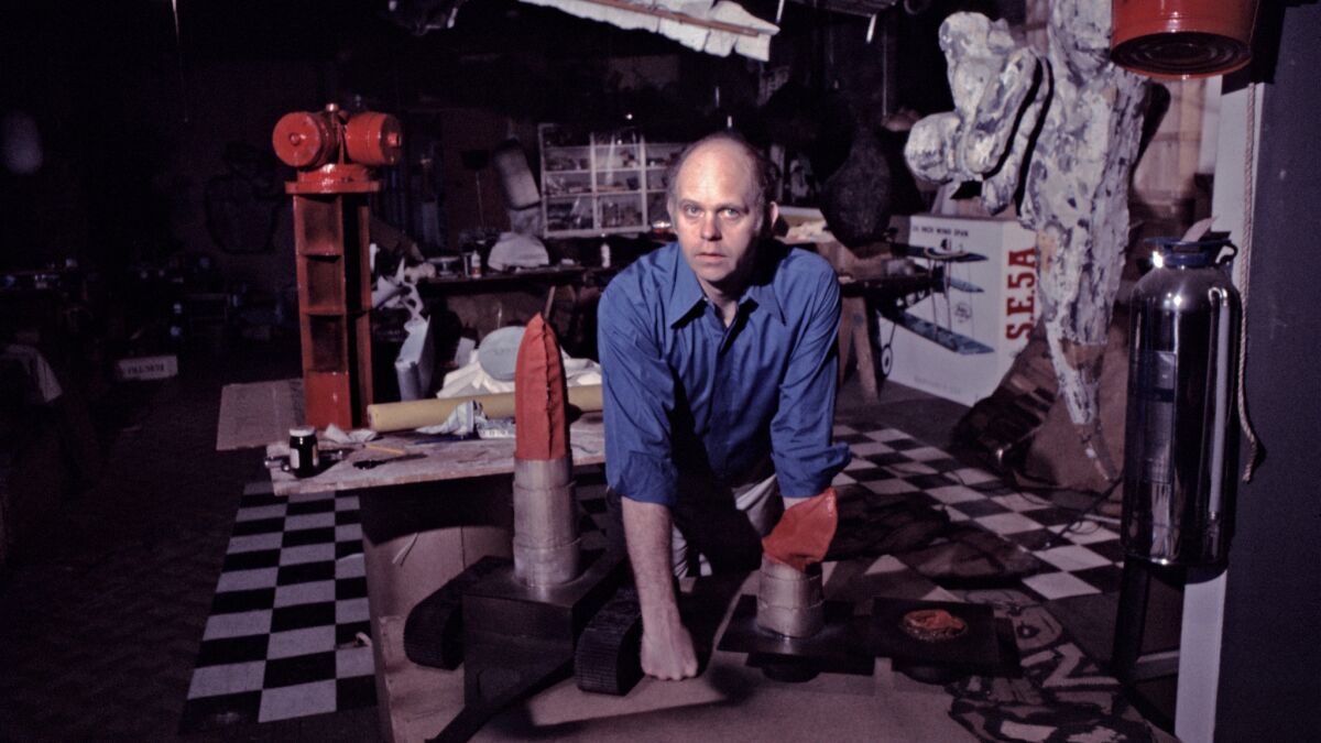 Swedish American sculptor Claes Oldenburg works in his studio in 1969.