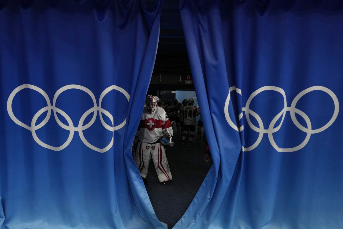 Switzerland goalkeeper Andrea Braendli waits to walk out on to the ice ahead of the women's bronze medal hockey game against Finland at the 2022 Winter Olympics, Wednesday, Feb. 16, 2022, in Beijing. (AP Photo/Petr David Josek)