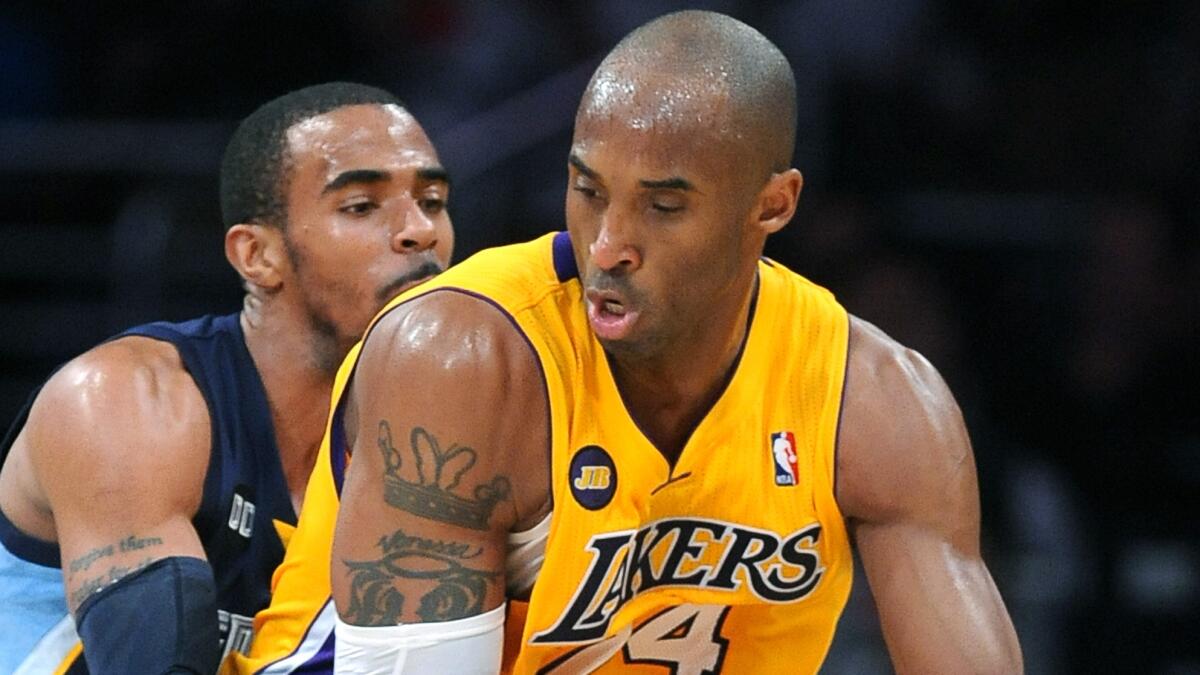 Memphis Grizzlies guard Mike Conley defends against Lakers star Kobe Bryant during a game in April 2013.