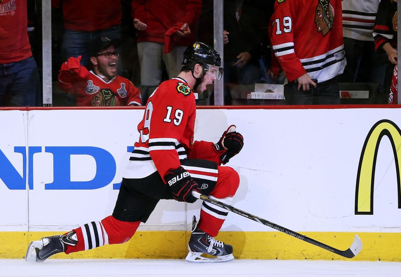 Blackhawks captain Jonathan Toews celebrates after scoring against the Kings late in the third period of Game 1, helping seal a 3-1 victory for Chicago.