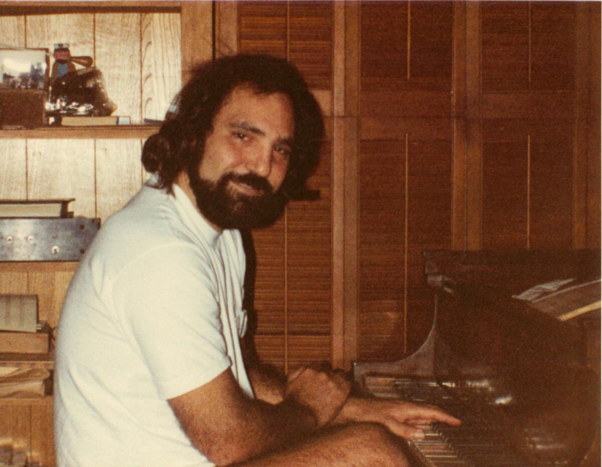 A man sits at the piano.