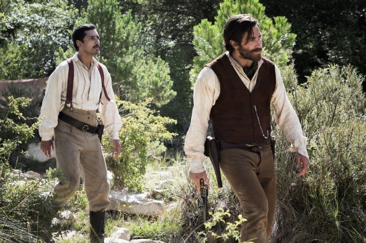 Riz Ahmed and Jake Gyllenhaal in Jacques Audiard's "The Sisters Brothers."