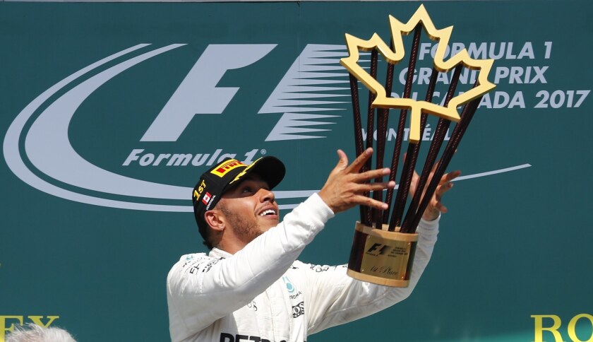 Formula One driver Lewis Hamilton celebrates after winning the Grand Prix of Canada on Sunday.