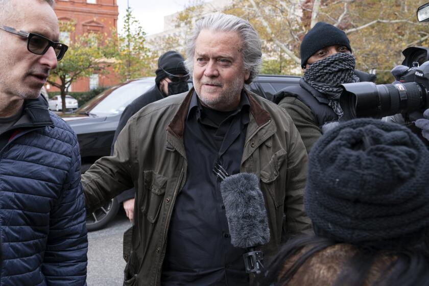 Former White House strategist Steve Bannon arrives at the FBI Washington Field Office, Monday, Nov., 15, 2021, in Washington. Bannon has surrendered to federal authorities to face contempt charges after defying a subpoena from a House committee investigating January’s insurrection at the U.S. Capitol. Bannon was taken into custody Monday morning. (AP Photo/Jose Luis Magana)