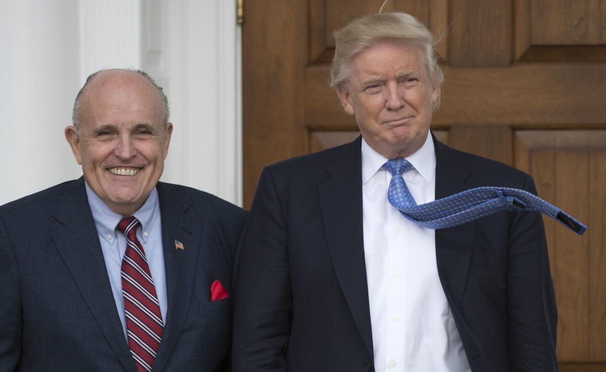 Former New York Mayor Rudy Giuliani is shown here with President-elect Trump in November 2016 at a Trump golf club in New Jersey.