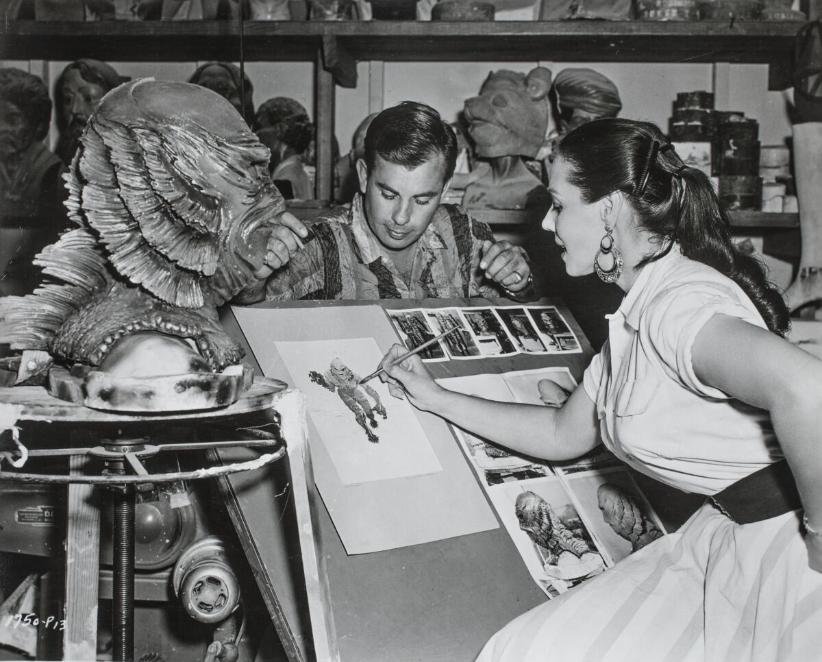 Designer Milicent Patrick sketches the “Creature From the Black Lagoon,” as seen in the exhibition “The Natural History of Horror.”