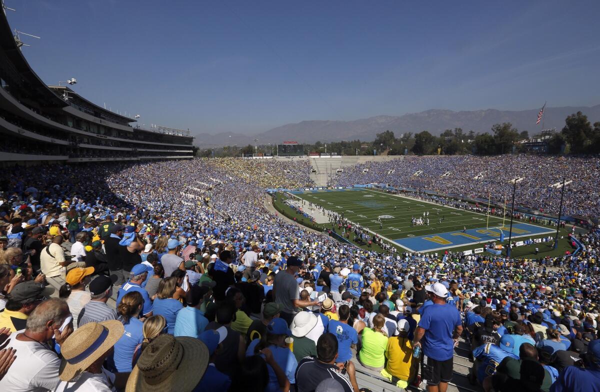 Fans watch UCLA take on Oregon at the Rose Bowl on Oct. 11, 2014.