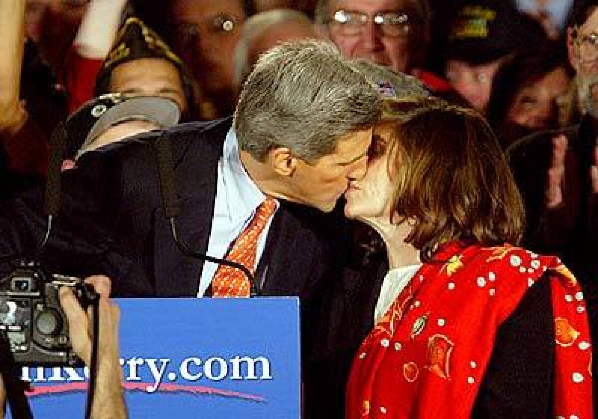 Sen. John Kerry kisses wife Teresa Heinz Kerry while celebrating his victory in the New Hampshire Primary in Manchester.