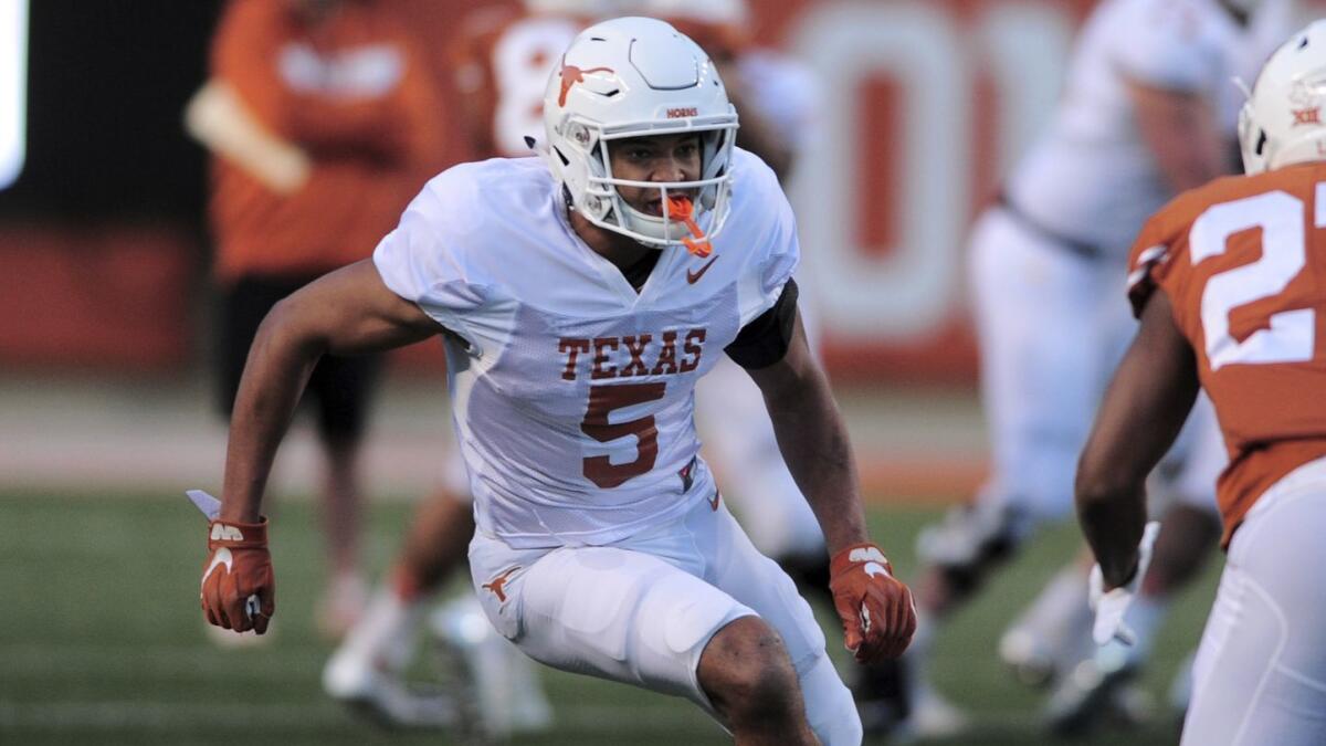 Wide receiver Bru McCoy runs a pass route during the Longhorns' spring game on April 13. McCoy has left Texas and intends to play for USC.