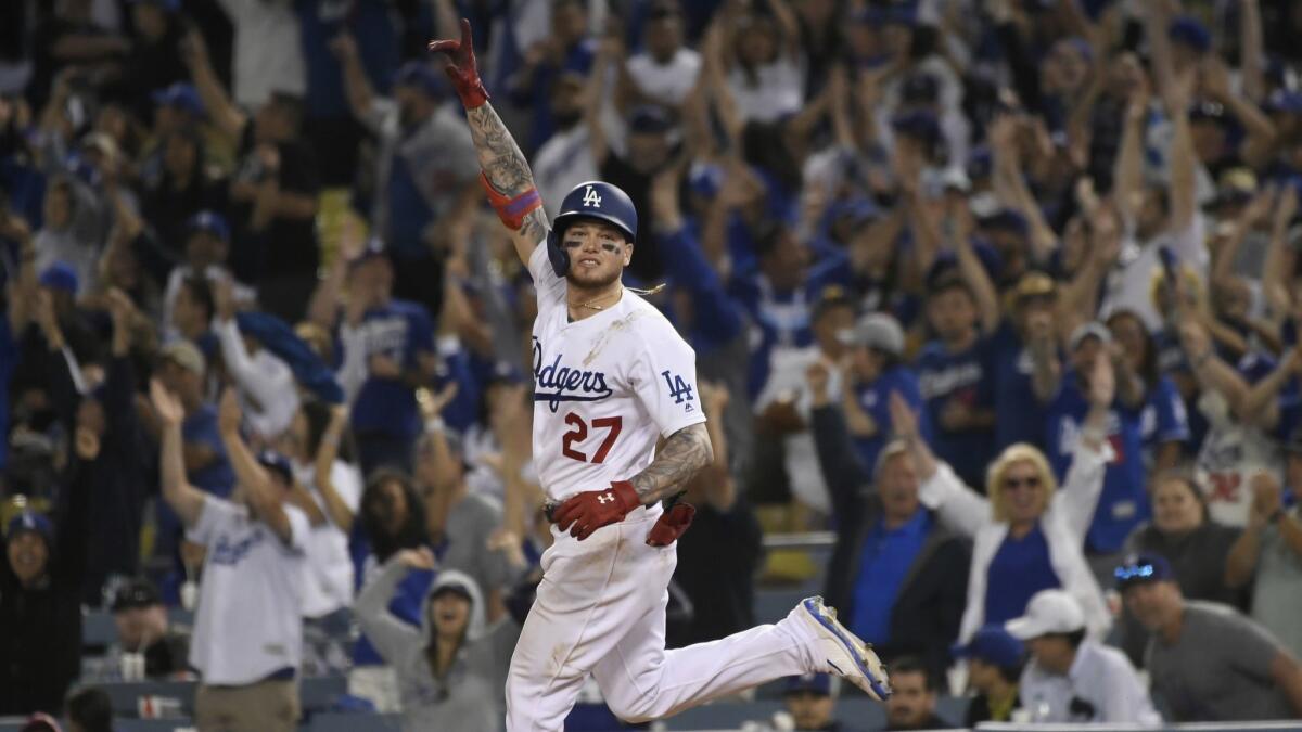 Alex Verdugo rounds the bases after his 11th-inning blast gave the Dodgers a 5-4 win over the Rockies on Saturday. It was the rookie's second homer of the game and fourth hit.