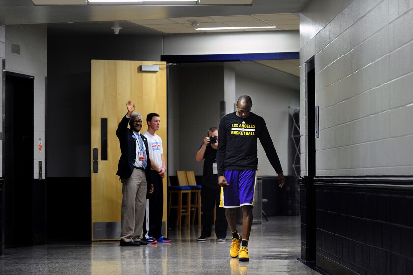 Lakers forward Kobe Bryant walks down the hallway to an opposing team's court for the final time after halftime against the Thunder.