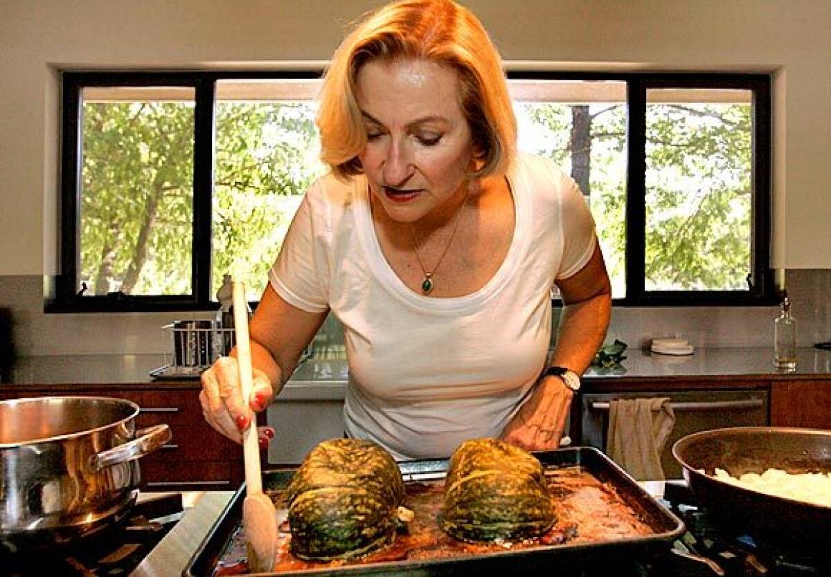 At home in Ojai, "Vegetarian Epicure" author Anna Thomas roasts kabocha squash for a soup in her new cookbook.