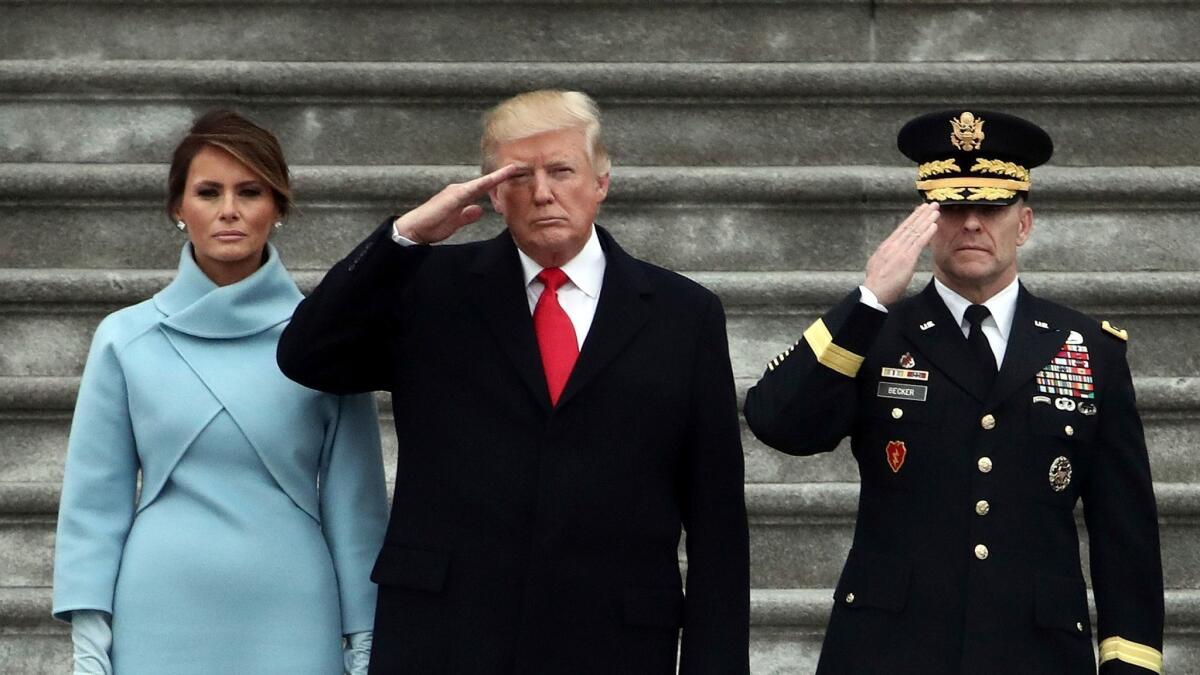 President Donald Trump with first lady Melania Trump and Maj. Gen. Bradley Becker review troops on the East Front of the Capitol in Washington on Jan. 20.