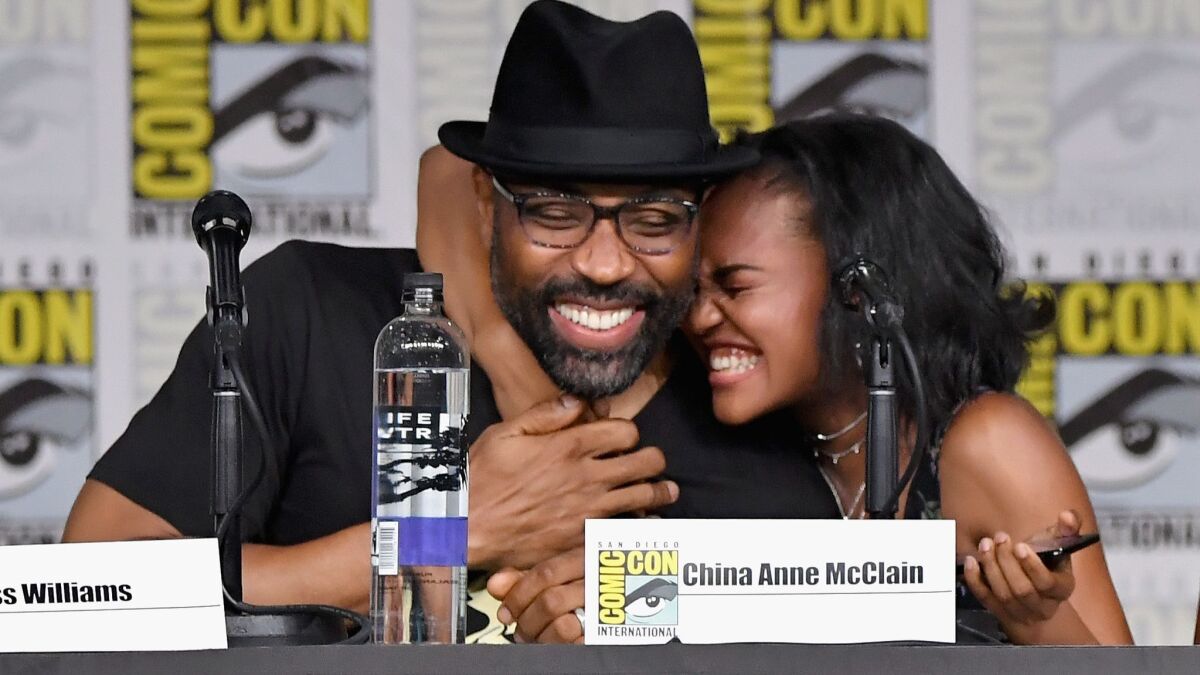 Cress Williams and China Anne McClain speak at the "Black Lightning" special video presentation and Q&A during Comic-Con International 2018.