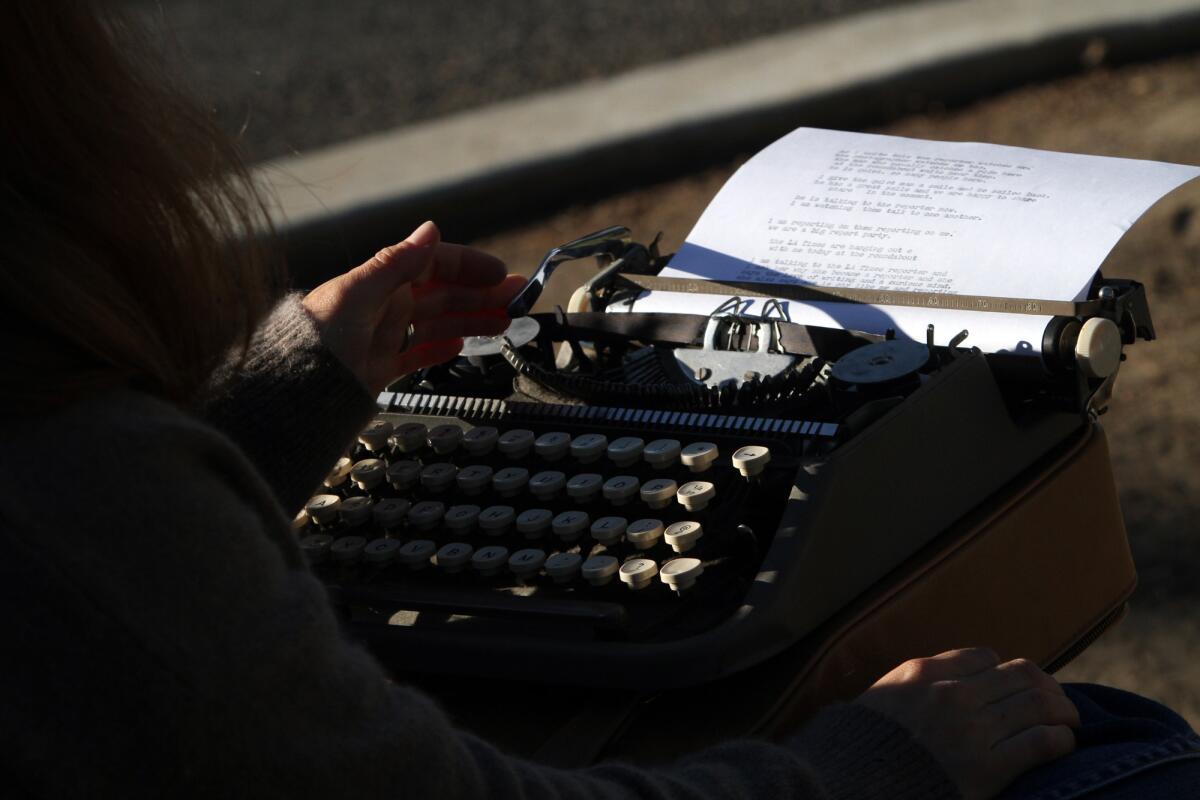 Stacy Dacheux sits at a small green roundabout in Echo Park, typing on her vintage typewriter, recording and becoming part of the daily ritual of people in her neighborhood.