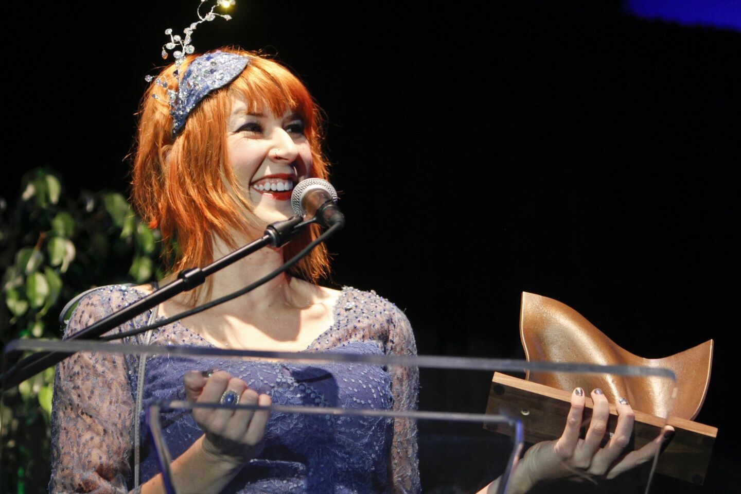 Winner of Best Singer Songwriter Gayle Skidmore receives her award.