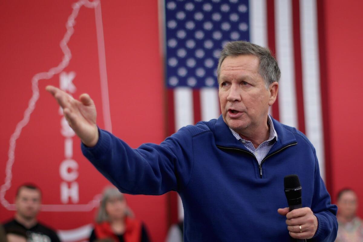 Republican presidential candidate and Ohio Gov. John Kasich campaigns in Bow, N.H.