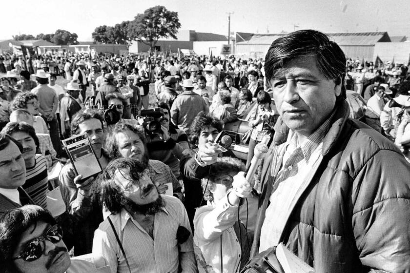 Cesar Chavez talks to striking Salinas Valley farm workers at a rally in 1979.