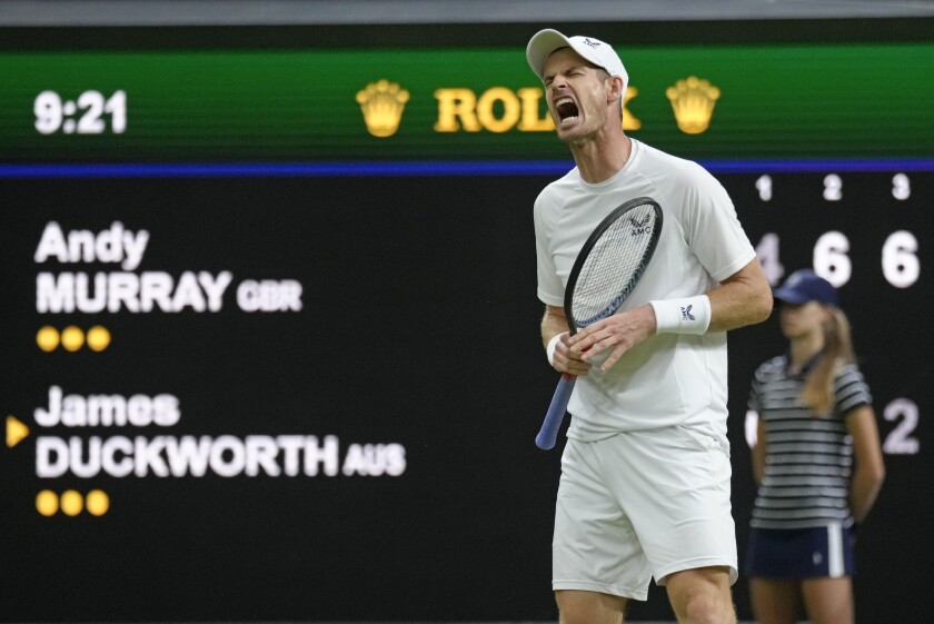 Britain's Andy Murray reacts after losing a point against Australia's James Duckworth in a first round men's singles match on day one of the Wimbledon tennis championships in London, Monday, June 27, 2022. (AP Photo/Kirsty Wigglesworth)