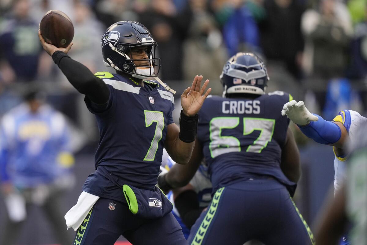 Seattle Seahawks quarterback Geno Smith throws against the Rams in the first half.