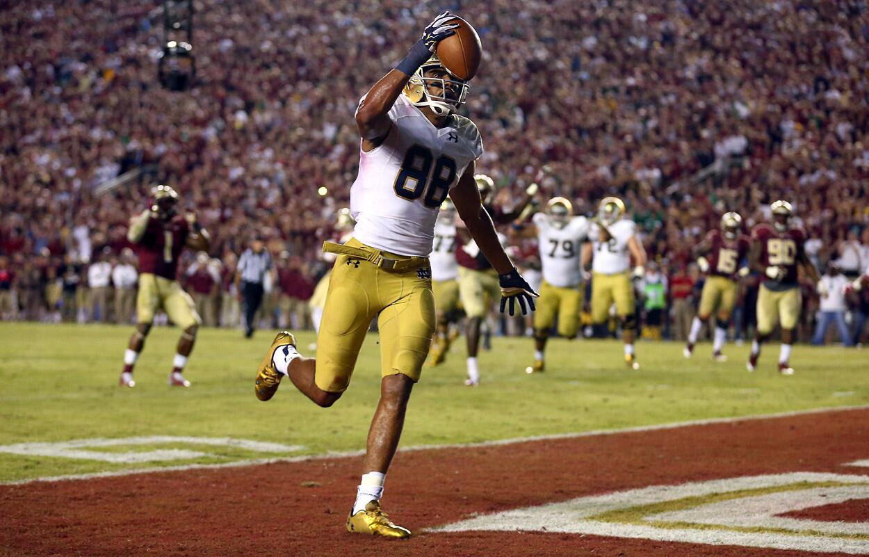 Notre Dame's Corey Robinson celebrates after catching what would've been a game-winning touchdown, but an offensive pass interference call nullified the play.
