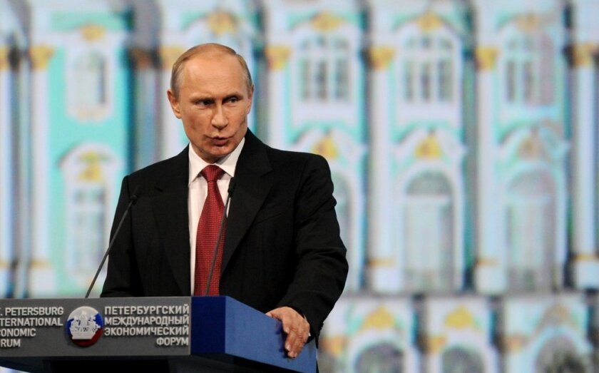 Russian President Vladimir Putin is seen speaking at the St. Petersburg International Economic Forum on May 23.
