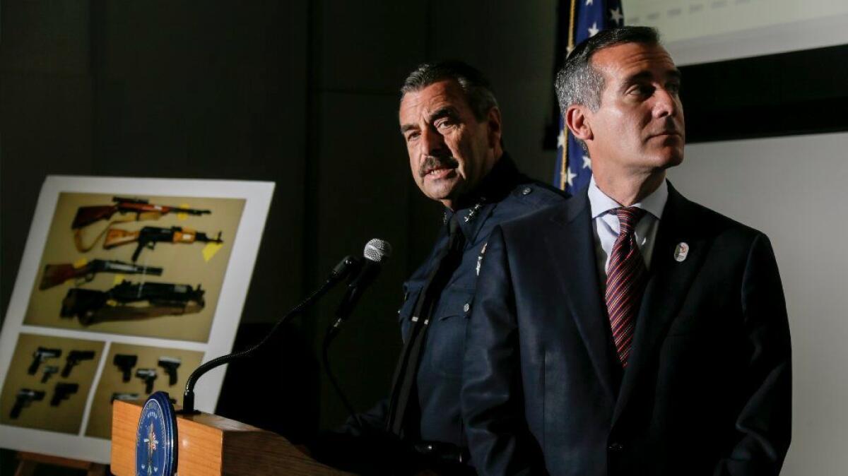 LAPD Chief Charlie Beck, left, and Mayor Eric Garcetti discuss crime in Los Angeles through the first half of 2016 during a news conference in July at police headquarters.