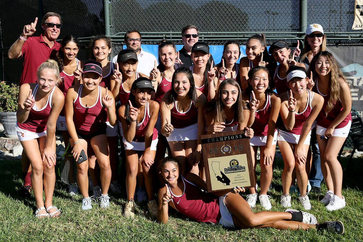 The La Canada High School girls tennis team celebrates winning the CIF SS Div. 2 championship at the Claremont Club in Claremont on Friday, Nov. 9, 2018.