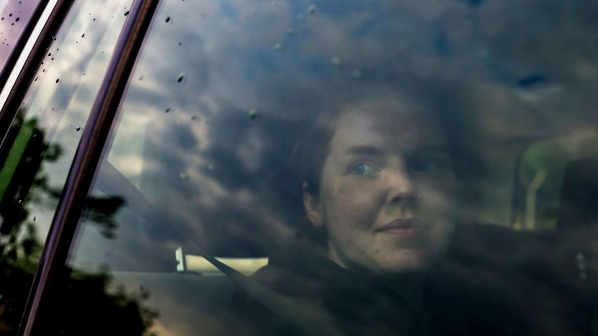Martha O'Donovan sits in the back of a U.S. Embassy vehicle as she leaves Chikurubi Maximum Prison near Harare on Nov. 10, 2017.