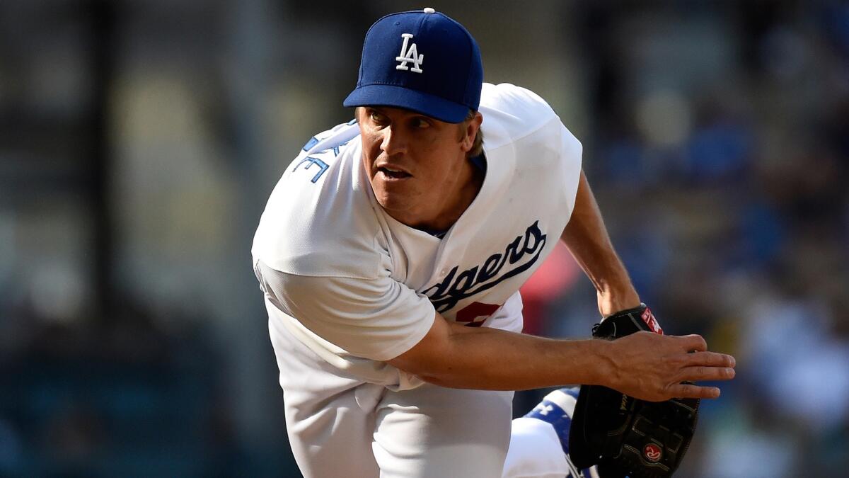 Dodgers starter Zack Greinke delivers a pitch during the first inning of Sunday's game against the Pittsburgh Pirates at Dodger Stadium.
