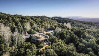 Aerial view of the house owned by actor Gene Hackman and Betsy Arakawa is surrounded by trees in a secluded hilly area.