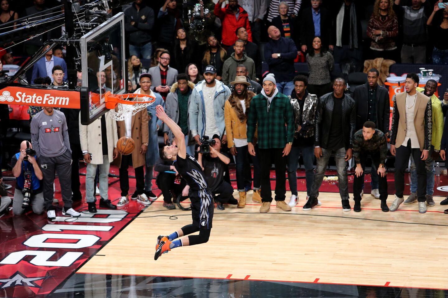 Minnesota guard Zach LaVine puts down a reverse dunk during the contest Saturday night in Toronto.