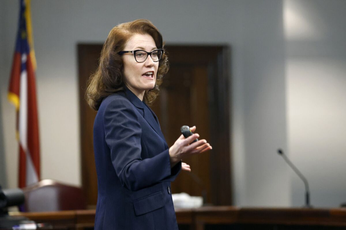 Prosecutor Linda Dunikoski speaks during opening statements in the trial of Greg McMichael and his son, Travis McMichael, and a neighbor, William "Roddie" Bryan at the Glynn County Courthouse, Friday, Nov. 5, 2021, in Brunswick, Ga. The three are charged with the February 2020 slaying of 25-year-old Ahmaud Arbery. (Octavio Jones/Pool Photo via AP)