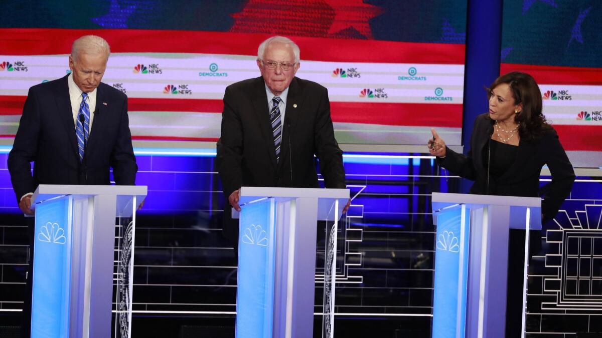 Former Vice President Joe Biden, left, Sen. Bernie Sanders and Sen. Kamala Harris were among the participants in Thursday night's Democratic debate.